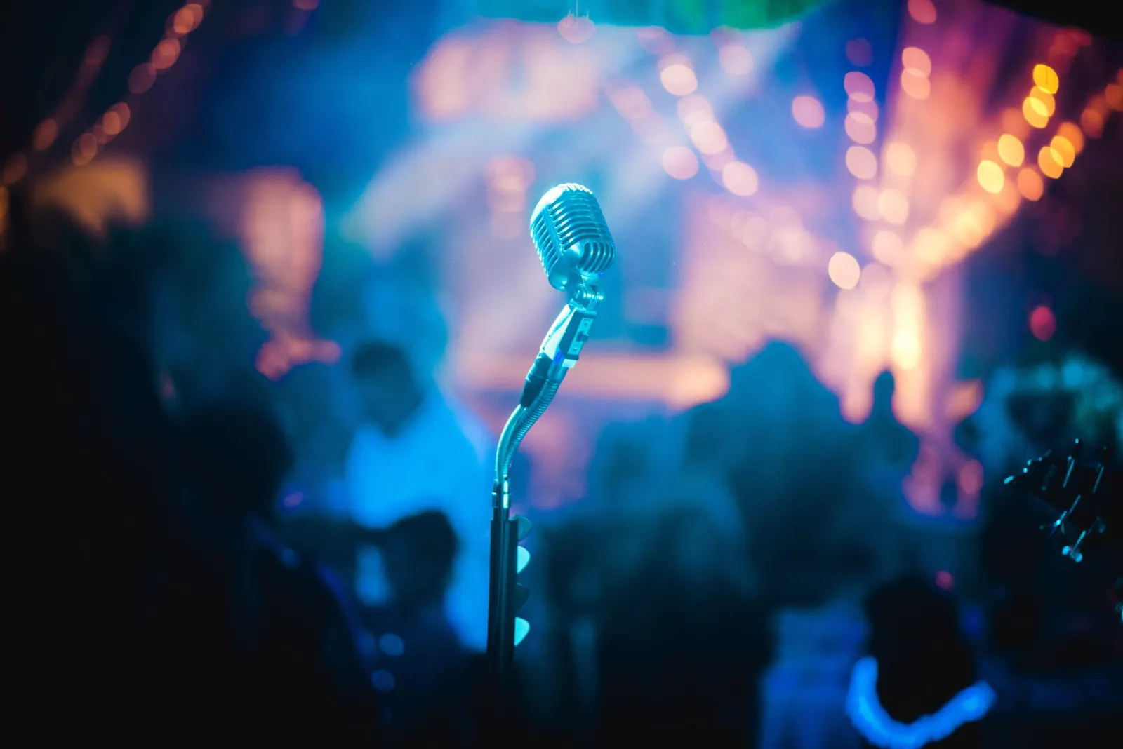 A microphone in front of stage lights